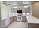 Bright kitchen with ample cabinetry and modern appliances at 13706 W Caballero Dr, Sun City West, AZ 85375