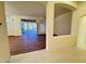 Spacious living room with wood-look flooring and access to patio at 13706 W Caballero Dr, Sun City West, AZ 85375