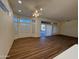 Spacious living room with hardwood floors, ceiling fan, and lots of natural light at 13706 W Caballero Dr, Sun City West, AZ 85375