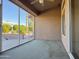 Cozy screened patio with ceiling fan and backyard view at 13706 W Caballero Dr, Sun City West, AZ 85375