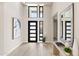 Entryway featuring high ceilings, modern door, and stylish decor at 14174 E Highland Ave, Fountain Hills, AZ 85268