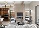 Living room showcasing fireplace, built-ins, and comfortable seating at 14174 E Highland Ave, Fountain Hills, AZ 85268