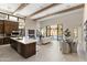 Open-concept living space featuring a gourmet kitchen, fireplace, and sliding glass doors at 14174 E Highland Ave, Fountain Hills, AZ 85268