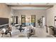 Open living area with fireplace, stylish furniture, and access to outdoor space at 14174 E Highland Ave, Fountain Hills, AZ 85268