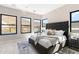 Main bedroom featuring large windows with great views, tufted headboard, and stylish furnishings at 14174 E Highland Ave, Fountain Hills, AZ 85268