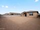 A large backyard and house exterior with a brick perimeter fence at 15995 W Cottontail Ln, Surprise, AZ 85387