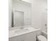 Bright bathroom featuring a white vanity, large mirror and walk-in shower at 15995 W Cottontail Ln, Surprise, AZ 85387