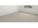 Cozy bedroom with neutral carpet and natural light at 15995 W Cottontail Ln, Surprise, AZ 85387