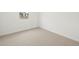 Clean bedroom with neutral carpet, a window with a view, and bright, fresh walls at 15995 W Cottontail Ln, Surprise, AZ 85387