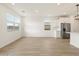 Open living space with wood-style floors and abundant natural light at 15995 W Cottontail Ln, Surprise, AZ 85387