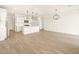 Spacious living area features wood-style floors and modern appliances at 15995 W Cottontail Ln, Surprise, AZ 85387