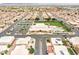 Beautiful aerial view of the community clubhouse, pool, tennis courts and manicured green spaces at 2101 S Meridian Rd # 131, Apache Junction, AZ 85120