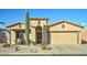 Charming single-story home featuring desert landscaping, a two-car garage, and a welcoming front entrance at 2101 S Meridian Rd # 131, Apache Junction, AZ 85120
