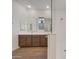Elegant bathroom with double sink vanity, tile floors and walk-in glass shower at 28250 N 134Th Ave, Peoria, AZ 85383