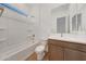 Bright bathroom featuring a tub and shower combination and wood-look tile at 28250 N 134Th Ave, Peoria, AZ 85383