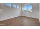 Bright and airy bedroom with large windows, offering plenty of natural light at 28250 N 134Th Ave, Peoria, AZ 85383