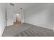 Bright bedroom with neutral carpet and a view of the open doorway at 28250 N 134Th Ave, Peoria, AZ 85383