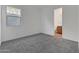 Neutral carpeted bedroom with a view of the bathroom at 28250 N 134Th Ave, Peoria, AZ 85383
