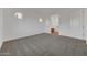 Neutral bedroom with large windows and access to the ensuite bathroom at 28250 N 134Th Ave, Peoria, AZ 85383