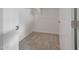 Walk-in closet with neutral carpet, white walls, and wooden rails at 28250 N 134Th Ave, Peoria, AZ 85383