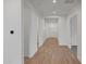 Bright hallway with wood-look tile and recessed lighting leading to the front door at 28250 N 134Th Ave, Peoria, AZ 85383