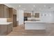 Modern kitchen featuring an island, stainless steel appliances, and sleek countertops at 28250 N 134Th Ave, Peoria, AZ 85383