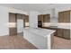 Modern kitchen featuring an island, stainless steel appliances, and sleek countertops at 28250 N 134Th Ave, Peoria, AZ 85383