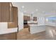 Modern kitchen featuring an island, stainless steel appliances, and sleek countertops at 28250 N 134Th Ave, Peoria, AZ 85383