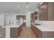 Modern kitchen featuring an island, stainless steel appliances, and sleek countertops at 28250 N 134Th Ave, Peoria, AZ 85383