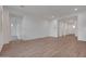 Spacious living room with wood-look tile floors and neutral paint at 28250 N 134Th Ave, Peoria, AZ 85383