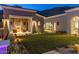 Landscaped backyard with fireplace and seating area at 10739 E Diamond Rim Dr, Scottsdale, AZ 85255