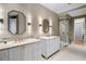 Modern bathroom with double vanity and glass-enclosed shower at 10739 E Diamond Rim Dr, Scottsdale, AZ 85255