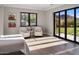 Serene bedroom with plush armchairs and access to backyard at 10739 E Diamond Rim Dr, Scottsdale, AZ 85255