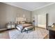 Well-appointed bedroom with plush bed and sitting area at 10739 E Diamond Rim Dr, Scottsdale, AZ 85255