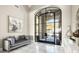 Elegant entryway with statement glass doors and modern decor at 10739 E Diamond Rim Dr, Scottsdale, AZ 85255