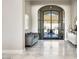 Spacious entryway with marble floors and modern glass doors at 10739 E Diamond Rim Dr, Scottsdale, AZ 85255