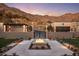 Elegant entry with fire pit and gated entrance at 10739 E Diamond Rim Dr, Scottsdale, AZ 85255
