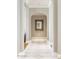 Elegant hallway with arched doorways and marble flooring at 10739 E Diamond Rim Dr, Scottsdale, AZ 85255