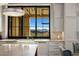Modern kitchen with stunning mountain views from the window at 10739 E Diamond Rim Dr, Scottsdale, AZ 85255