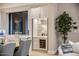 Built-in bar area with wine fridge and glass shelving in kitchen at 10739 E Diamond Rim Dr, Scottsdale, AZ 85255