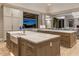 Large kitchen island with farmhouse sink and professional range at 10739 E Diamond Rim Dr, Scottsdale, AZ 85255