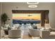 Spacious living room features stunning sunset views and access to the pool area at 10739 E Diamond Rim Dr, Scottsdale, AZ 85255