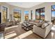 Bright living area with large windows and comfortable seating at 10739 E Diamond Rim Dr, Scottsdale, AZ 85255