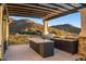 Modern outdoor kitchen with mountain views at 10739 E Diamond Rim Dr, Scottsdale, AZ 85255