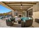 Relaxing outdoor patio with fireplace and seating at 10739 E Diamond Rim Dr, Scottsdale, AZ 85255