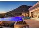 Expansive pool with fire pit and mountain views at 10739 E Diamond Rim Dr, Scottsdale, AZ 85255