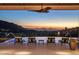 Infinity pool at sunset with mountain views at 10739 E Diamond Rim Dr, Scottsdale, AZ 85255
