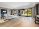 Large recreation room with hardwood floors and sliding doors at 10739 E Diamond Rim Dr, Scottsdale, AZ 85255