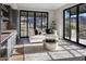 Bright sitting room with a comfy couch and access to a balcony at 10739 E Diamond Rim Dr, Scottsdale, AZ 85255