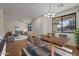 Dining area with wood table and chairs, adjacent to living room at 1670 E Joseph Way, Gilbert, AZ 85295